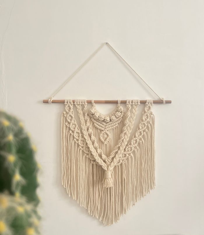 Beautiful handcrafted macrame wall hanging, perfect for elegant home decor and bohemian style.